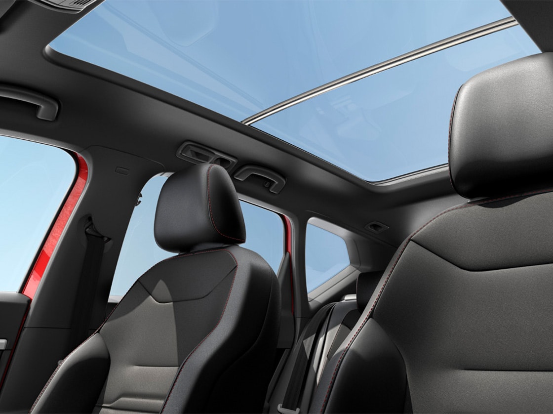 rear side view of the seat ateca parked in a sunny, urban spot.