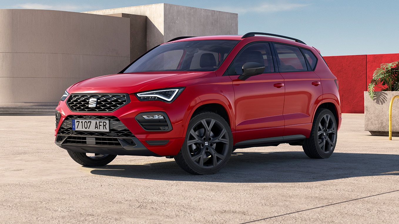 red seat ateca with aerodynamic urban bumpers and black roof rails.