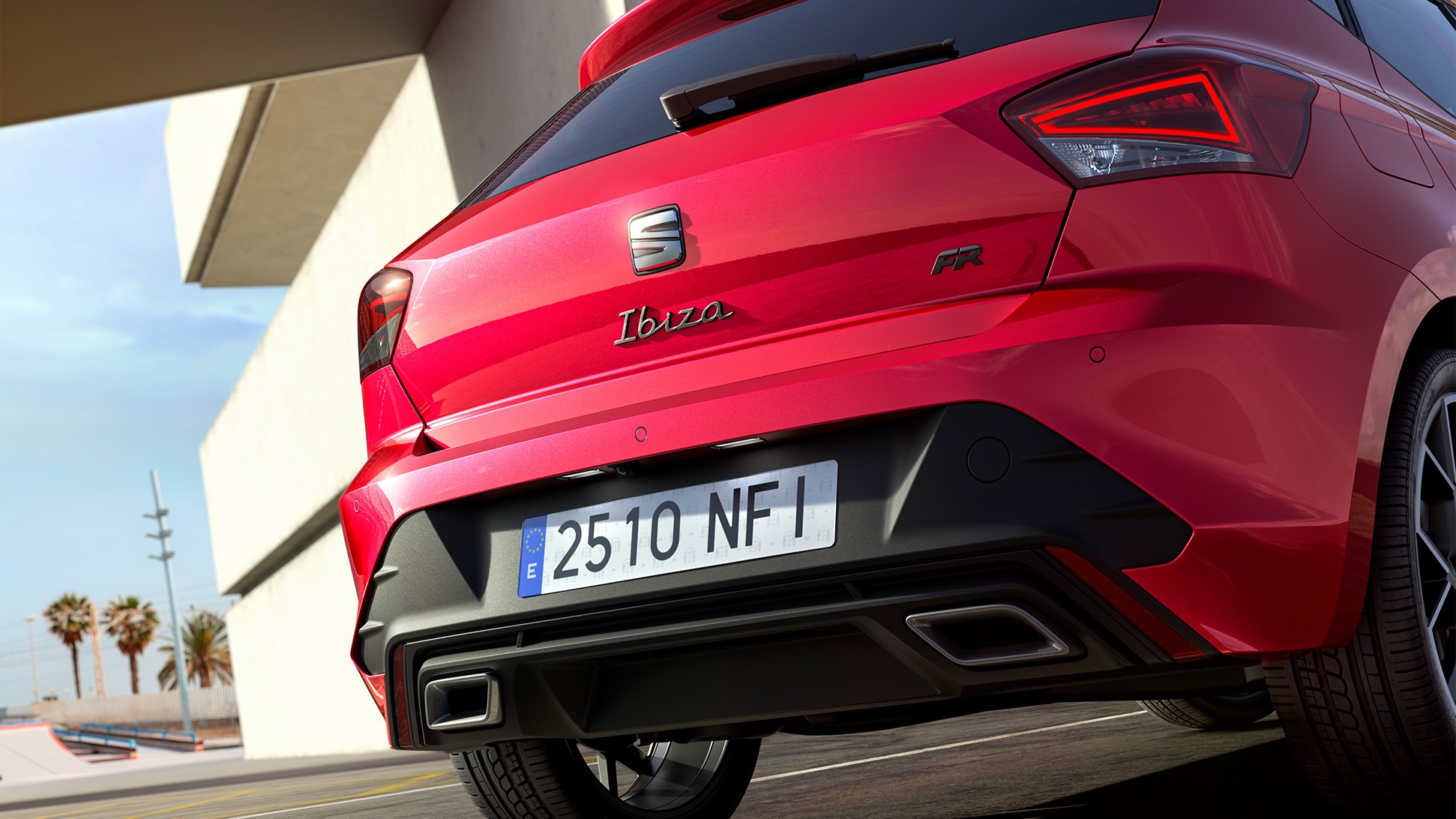 Rear view of a seat ibiza in red, parked outdoors.  Rear view of a seat ibiza in red, parked outdoors.
