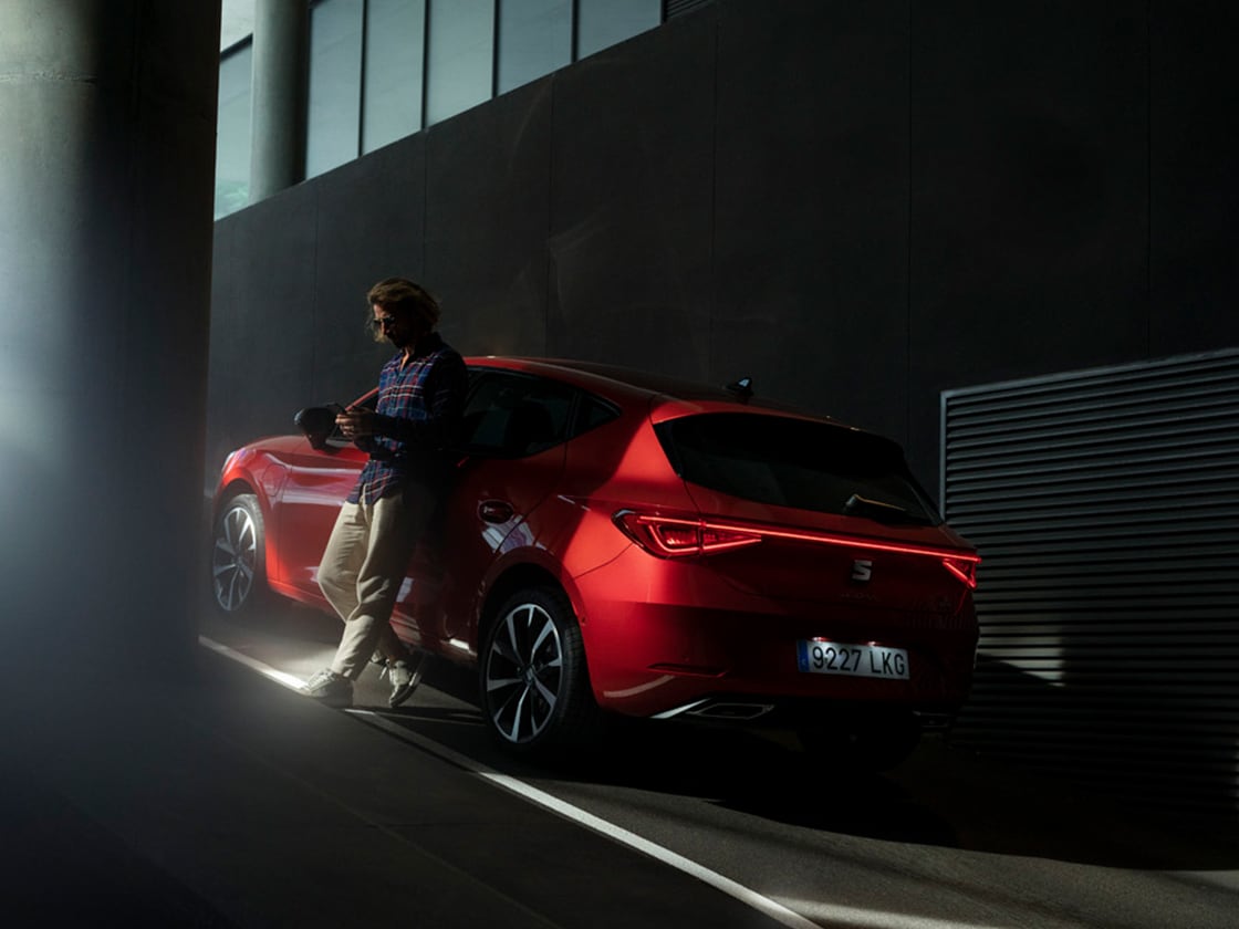 A red seat car in a snowy mountain setting with car insurance for vehicle coverage.