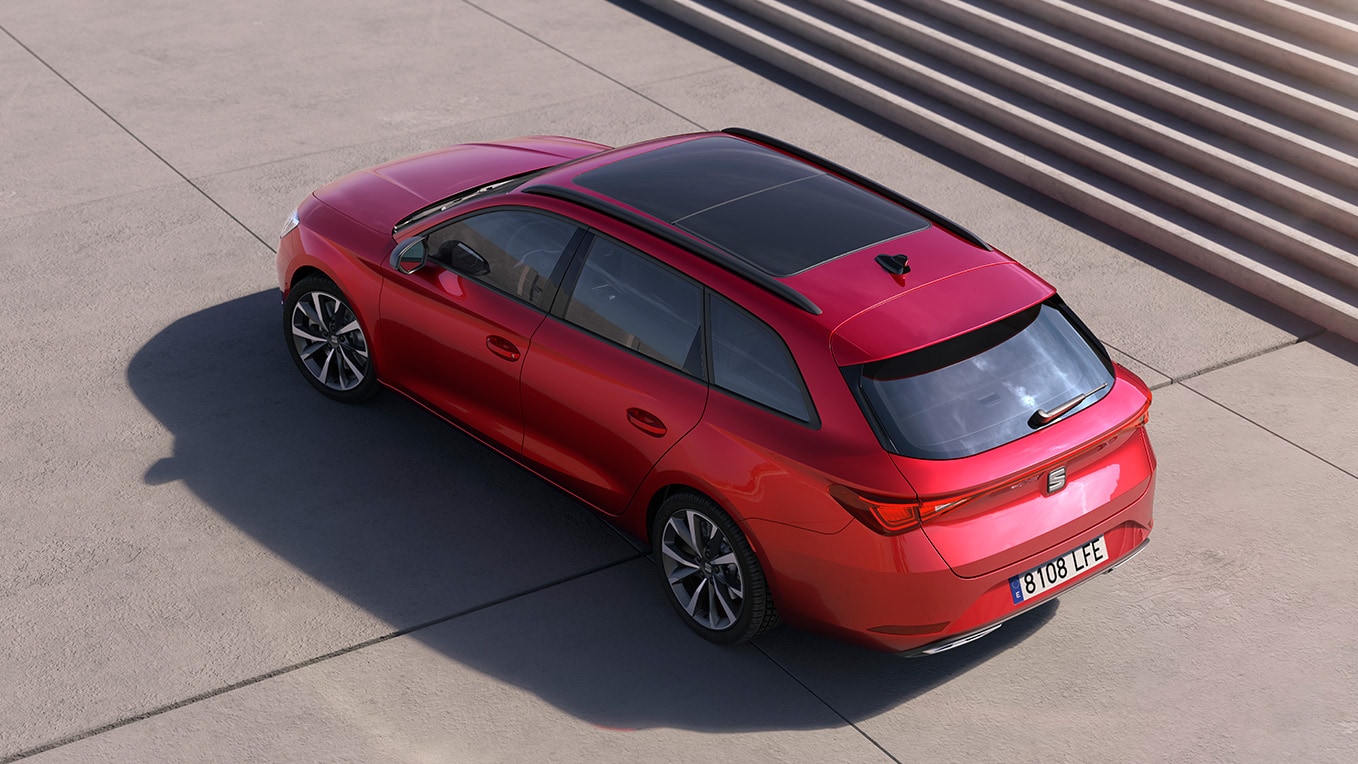 Eagle's-eye view of a SEAT Leon NF Sportstourer parked outdoors in the sunshine, with stairs in the background.