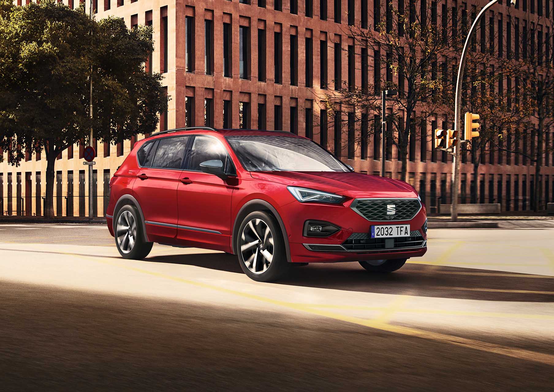 Red SEAT Tarraco with alloy wheels driving