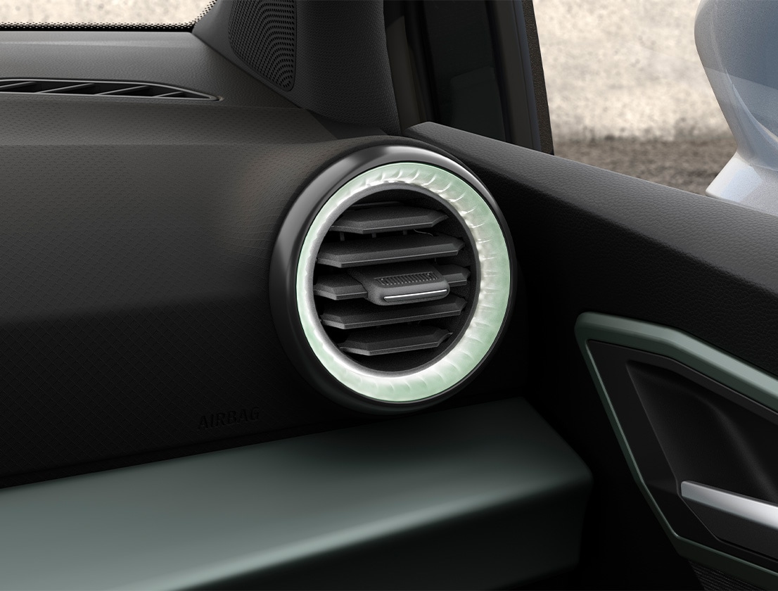 Close-up of SEAT Arona SUV interior showing circular air vent with ambient lighting