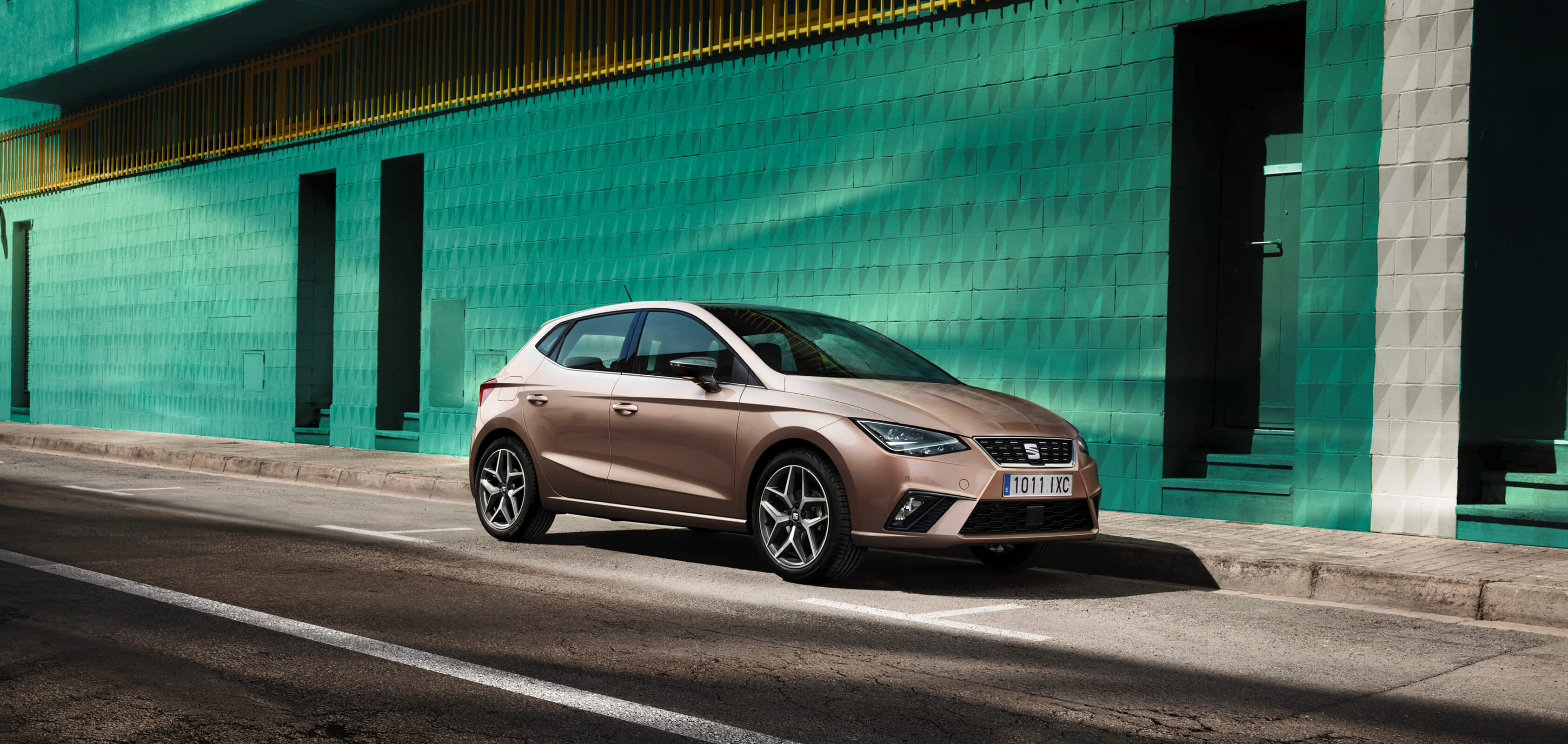 SEAT Arona front view on road color orange eclipse