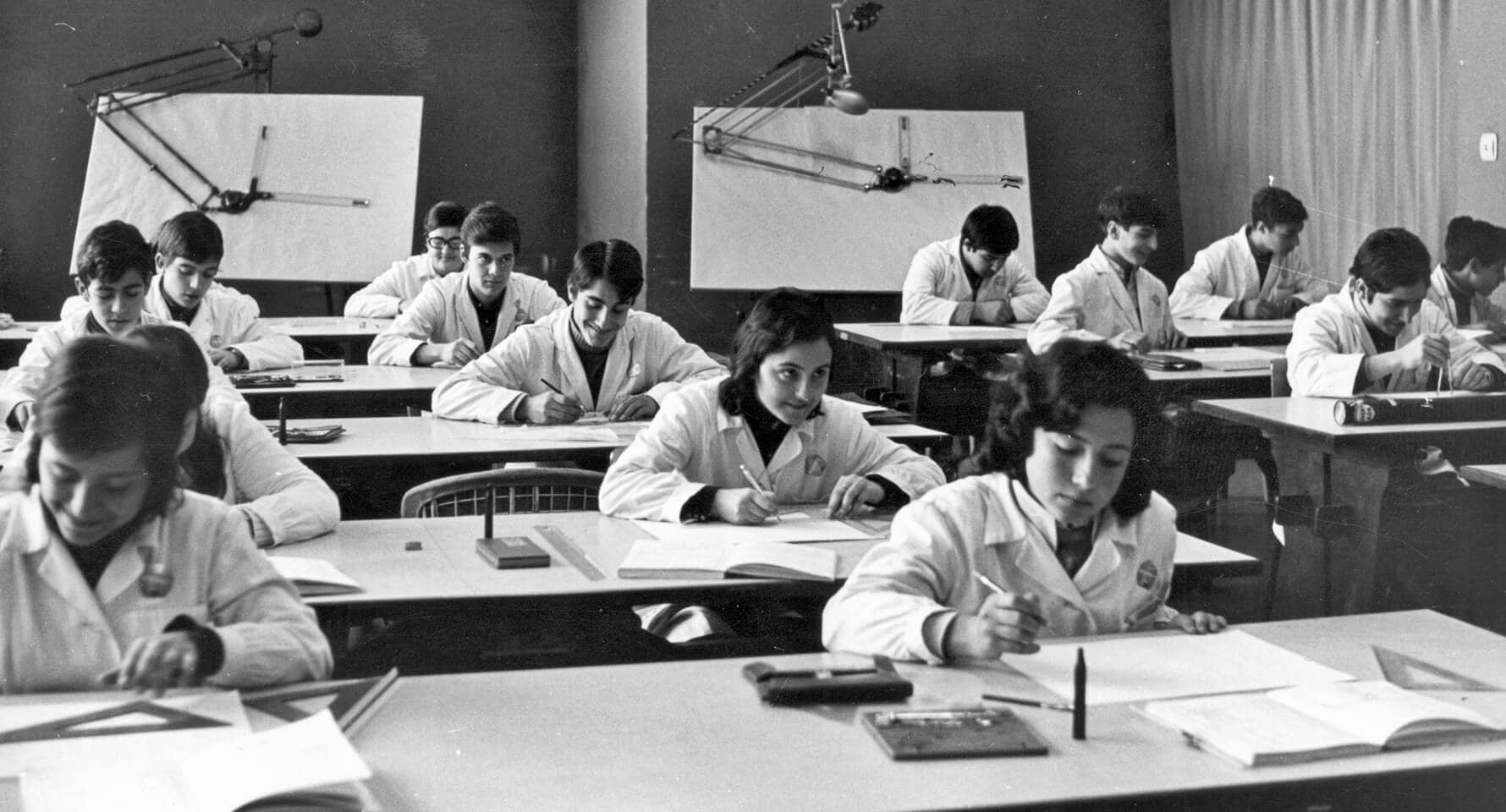 SEAT designers in a classroom, with a white coat.