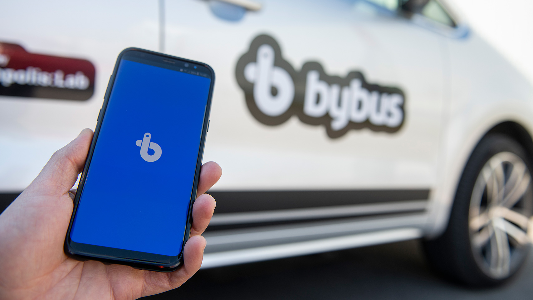 SEAT employee ordering a ride with the ByBus mobile app