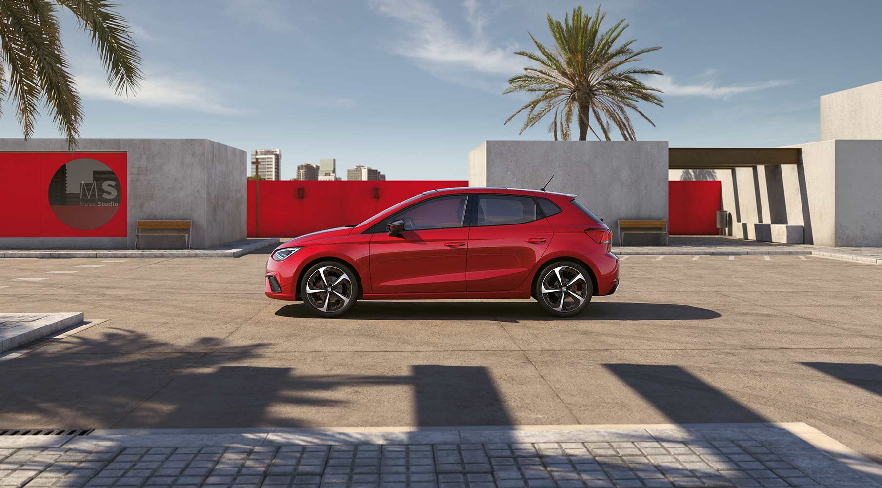 SEAT Ibiza parked outside in a red scene behind