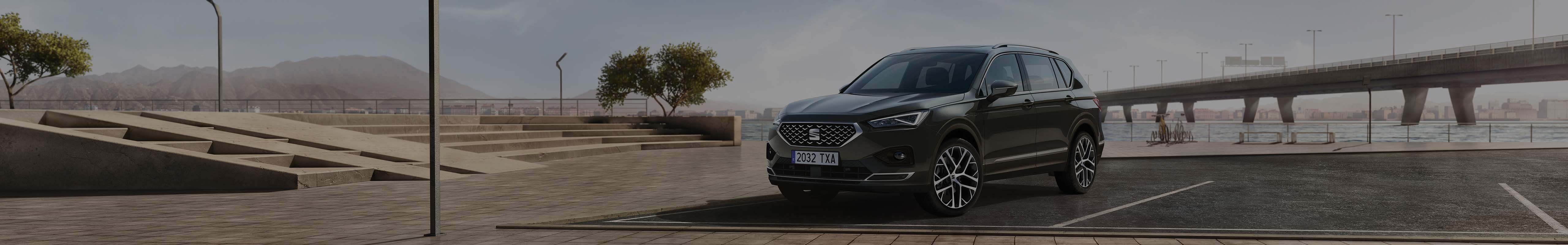 Right view of the SEAT Tarraco XPERIENCE Dark Camouflage colour in a parking lot