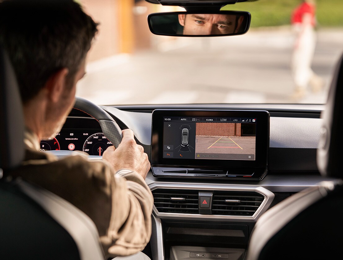 man using park assist with rearview camera