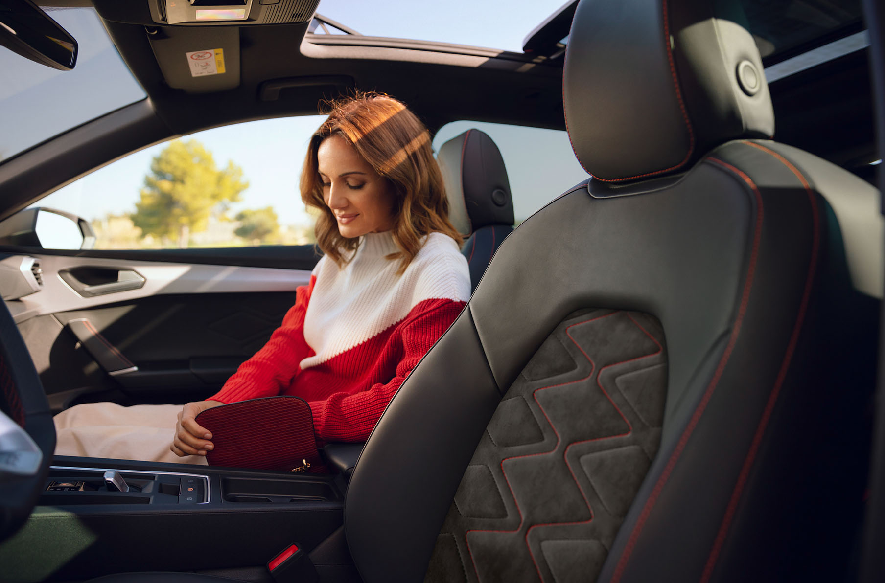 woman sitting in the passenger seat, enjoying the seat interior