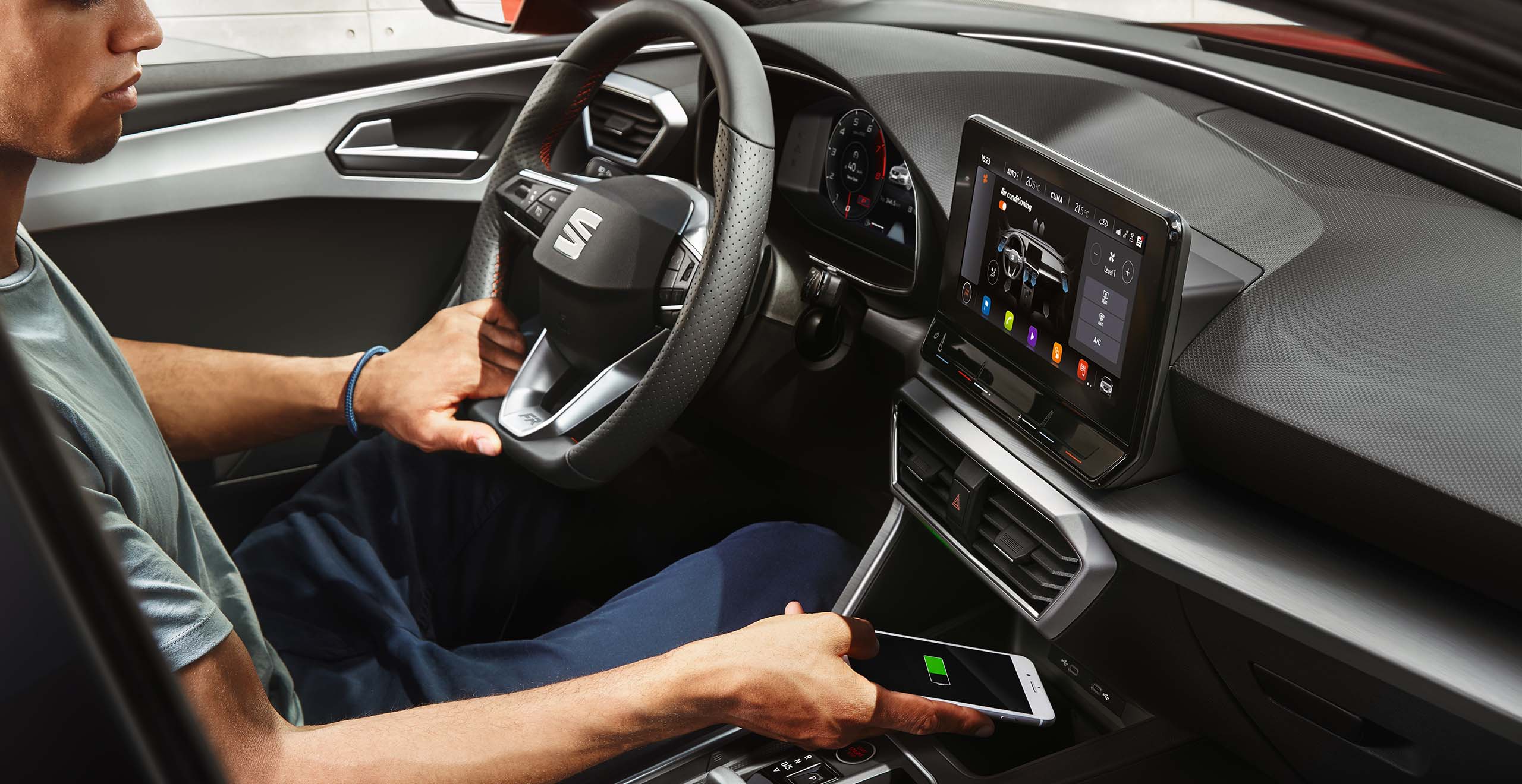 man-inside-seat-leon-conecting-the-phone