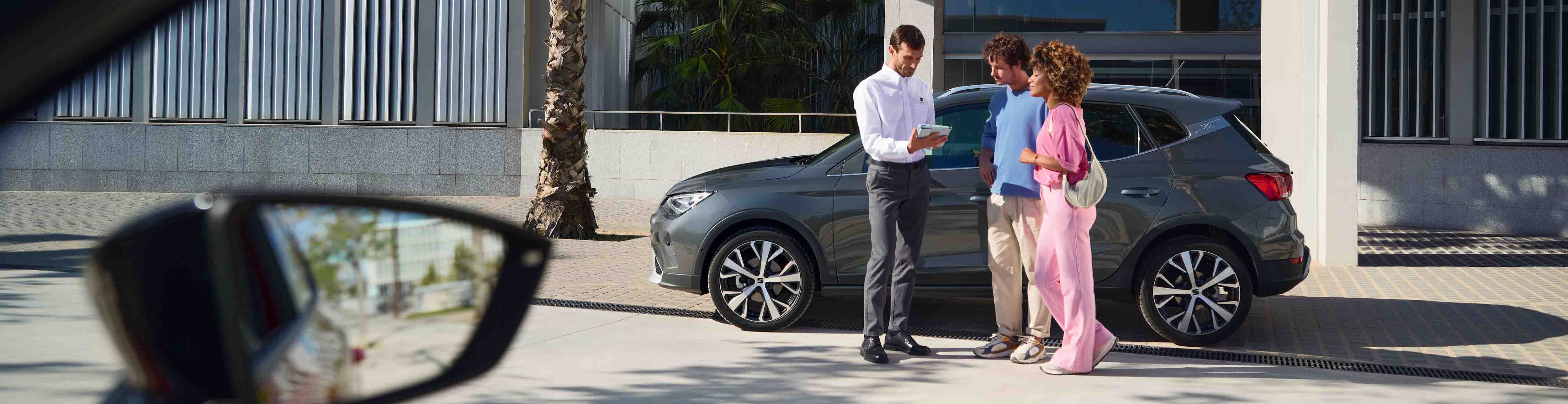 family-enjoying-a-picnic-while-a-seat-leon-is-parked 