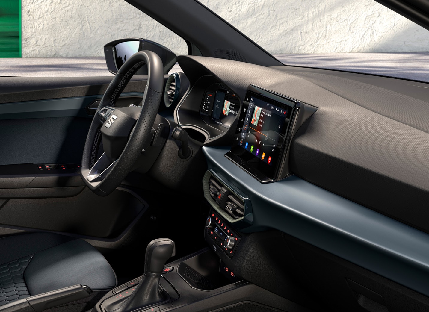 A view of the interior of a SEAT Arona, showing the front passenger seat and the rear seats. The seats are dark gray cloth with a patterned insert, and the dashboard features a blue-gray accent trim.