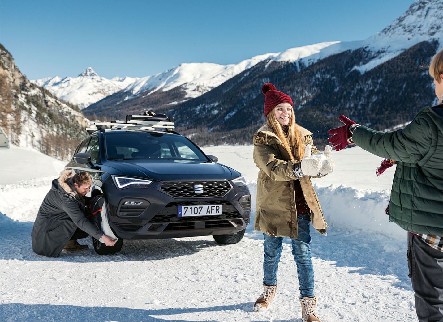 family-in-a-camping-with-car-behind