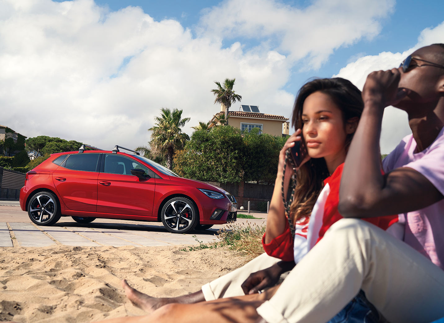 couple-in-the-beach-with-seat-ibiza-behind