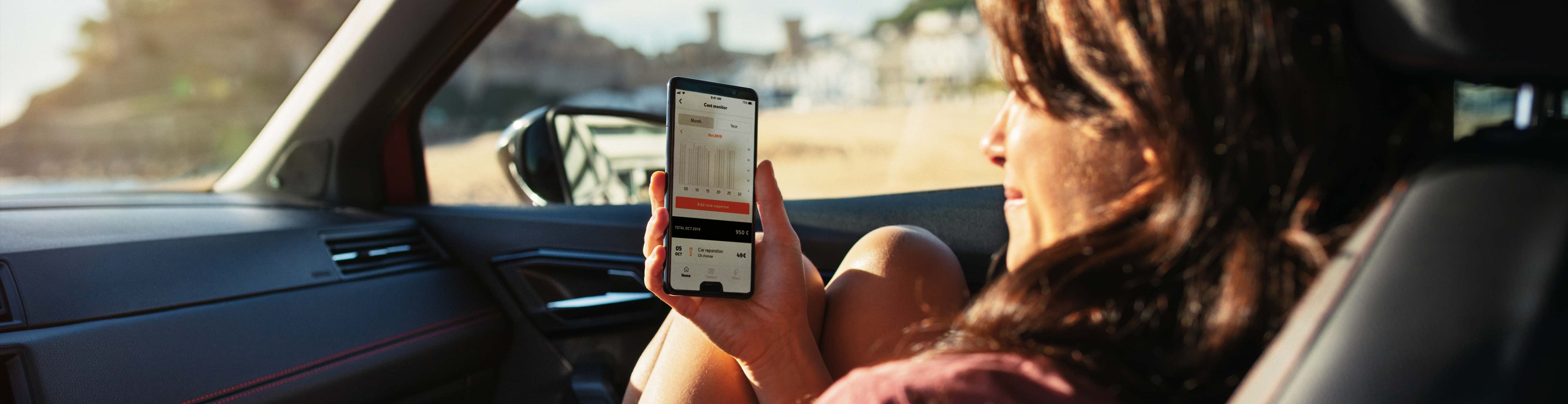 woman-seated-in-the-passenger-seat-browsing-my-seat-app